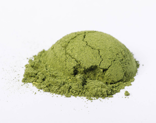 Heap of matcha green tea powder isolated on white background, Organic product from the nature for healthy with traditional style - Foto, Imagen