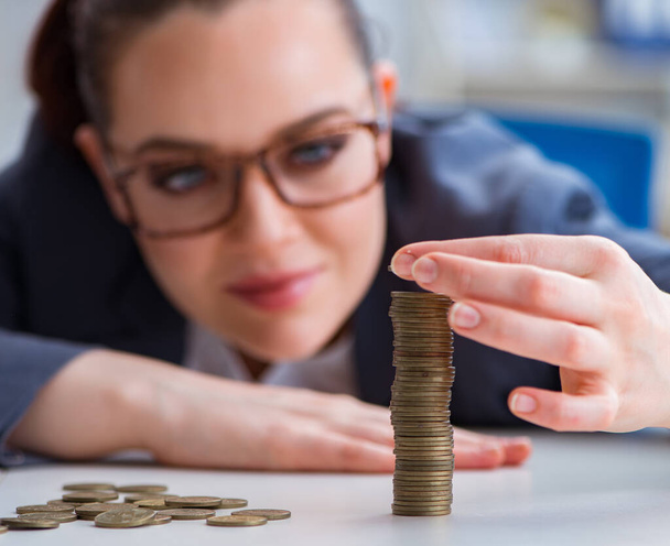 Businesswoman with coins in forex concept - Photo, Image