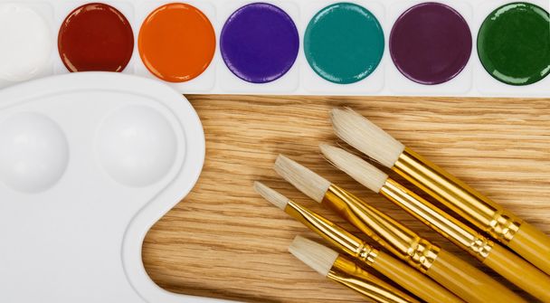 Paint and paintbrush - Фото, изображение