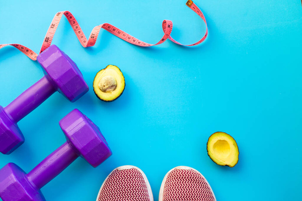 Fitness equipment dumbbells on color background. Flat lay. - Photo, Image