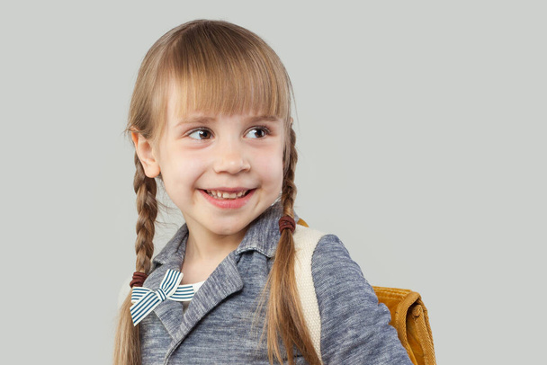 Happy little girl student with school bag. Back to school concept - Photo, Image
