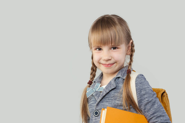 Happy child girl student on white background. Back to school concept - Photo, Image