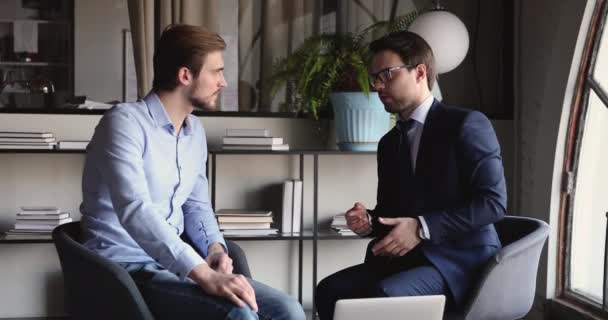 Two male executive partners working together, talking at office meeting - Filmmaterial, Video