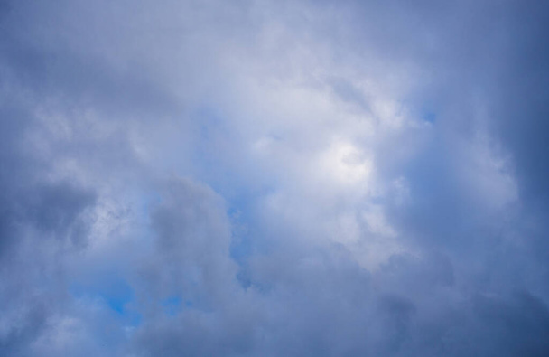 Fluffy clouds cover the summer blue sky - Fotoğraf, Görsel