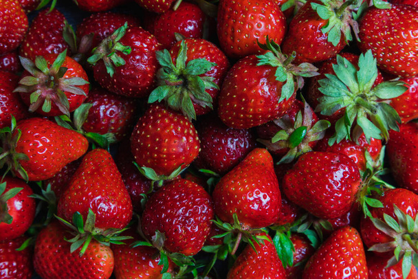 Top background view on lots of strawberries macro horizontal, directly above - Foto, immagini