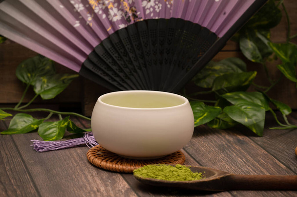 Matcha green tea latte in Japanese tea set - Photo, Image
