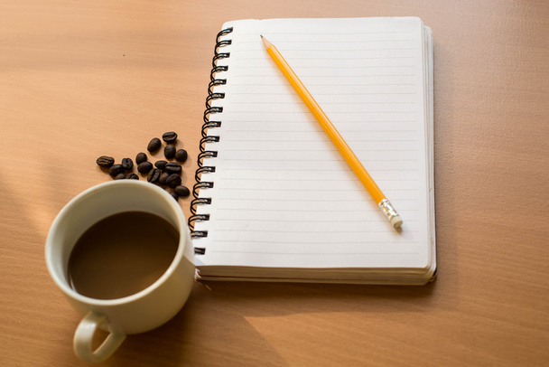 blank notebook coffee cup on wooden background - Foto, imagen