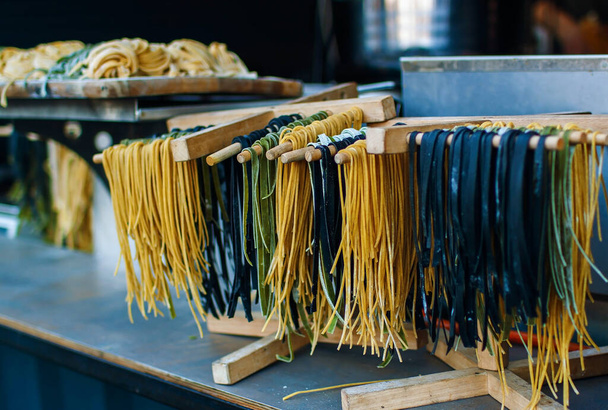 Colorful Food Background Of Raw Twisted Pasta - Фото, зображення