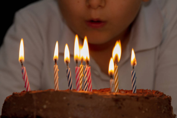 Making a Wish on His Birthday on dark - Photo, image
