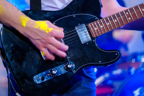 Guitarist playing electric guitar at live concert - Photo, Image