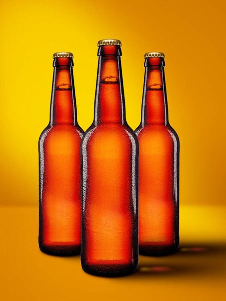 Beer bottles with long neck on yellow background. Mock-up design presentation. - Fotografie, Obrázek
