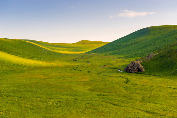 beautiful landscape on a sunny day, smooth green beautiful valley of the mountains of Armenia in June - Photo, Image