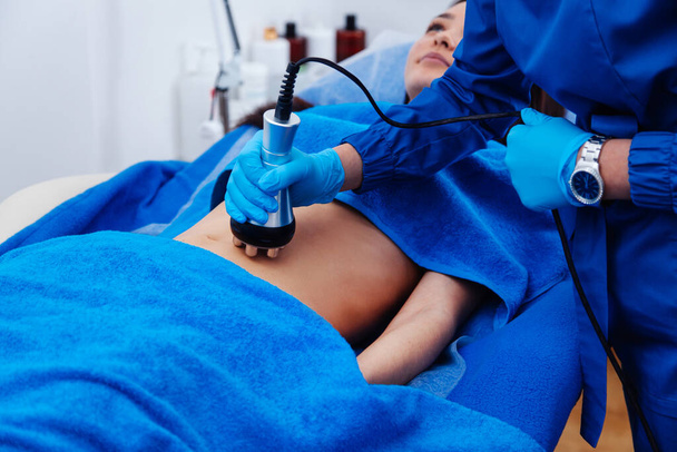 radiofrequency lifting process on the left abdomen - Foto, immagini