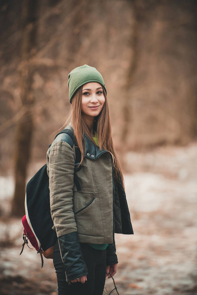 Portrait of young travel woman in forest - Фото, изображение