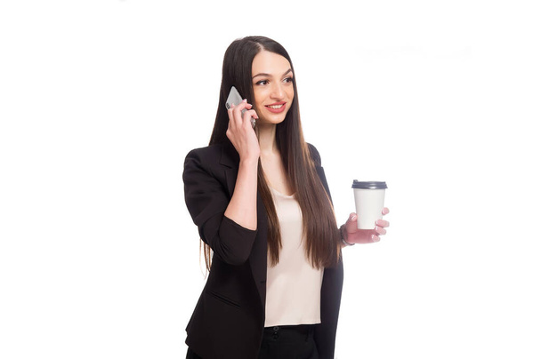 Coffe to go concept Young beautiful woman holding coffee cup. Smiling student girl holding coffee cup with space for text.Isolated on white background.coffe concept bussines. - Photo, Image