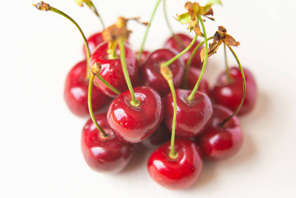 Ripe cherries on a wooden surface - Fotó, kép