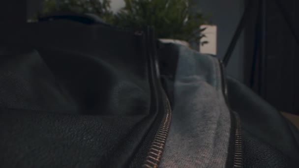 Macro view of the black leather jacket with a zipper. - Filmati, video