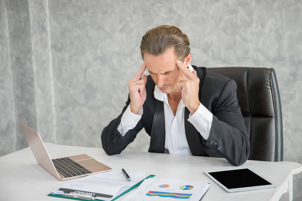 Serious businessman stressed out at work in office. fail business concept. - Foto, immagini