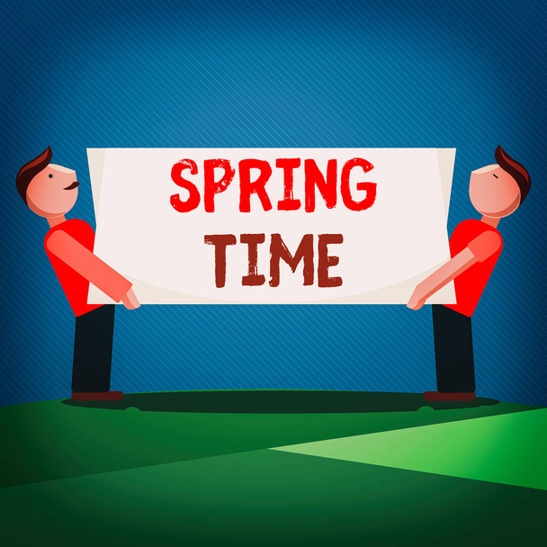 Handschrifttekst Spring Time. Concept betekent gematigd seizoen van het jaar geïdentificeerd door een opleving van planten Twee mannen staande dragen rechthoekige lege paneel boord op beide zijden. - Foto, afbeelding
