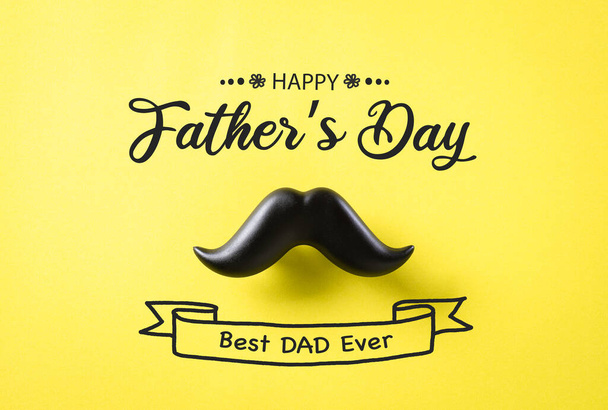 Father's day concept. Black moustache on yellow paper background. - Photo, Image