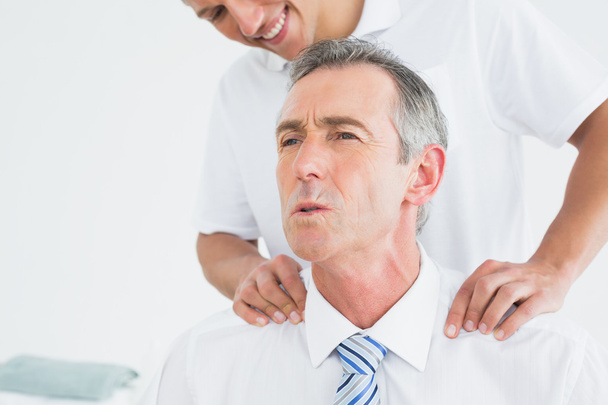 Chiropractor massaging patients neck - Foto, Imagem