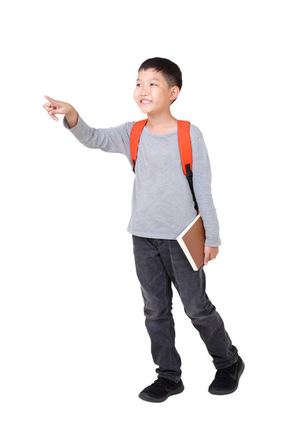 Asian Boy School kid holding book Hand up with orange backpack. Full Body isolated on White background.frantic.excited. - Photo, image