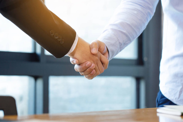 Business people shaking hands, finishing up a meeting.handshake of happy business people after contract agreement to become a partner,collaborative teamwork. - Foto, Imagem