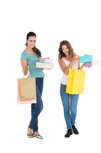 Two happy young female friends with shopping bags - Foto, immagini