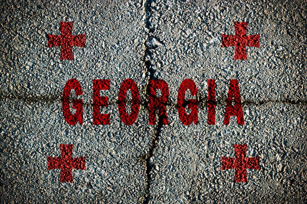 drapeau de la Géorgie sur un fond de fissures sur le trottoir
. - Photo, image