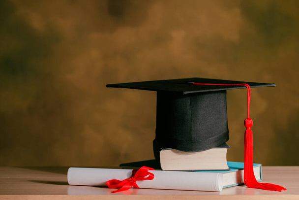 Graduation day,graduation cap,books and certificated on wooden.Graduation concept - Φωτογραφία, εικόνα
