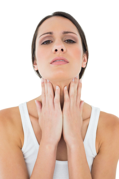 Close-up of a casual woman suffering from neck ache - Photo, Image