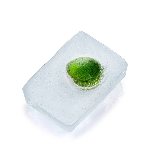 Fresh lime frozen in ice isolated on white background - Fotografie, Obrázek