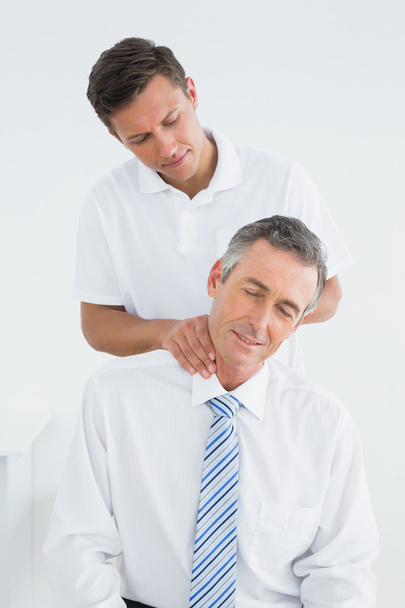 Chiropractor doing neck adjustment - Photo, image