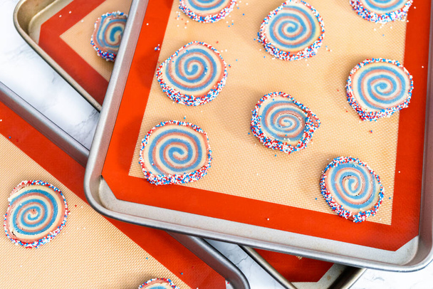 Baking red, white, and blue pinwheel sugar cookies for July 4th celebration. - Photo, Image
