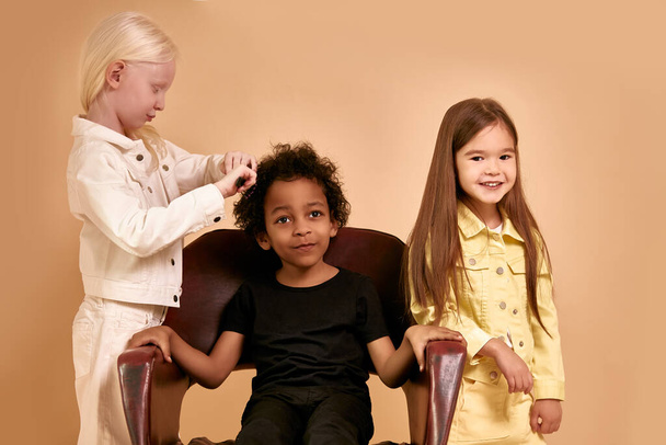 funny kids combing hair to each other - Photo, image