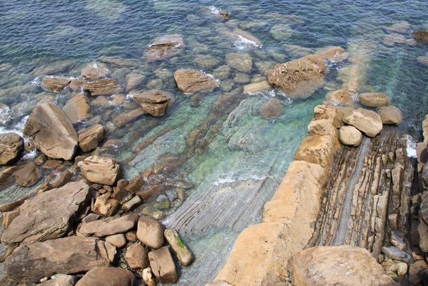 bottom of rocks and crystal clear sea in the Basque Country - Photo, Image