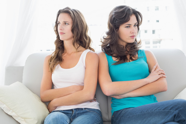 Unhappy friends not talking after argument at home - Foto, imagen