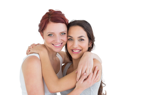 Close-up portrait of a young female embracing her friend - Foto, imagen