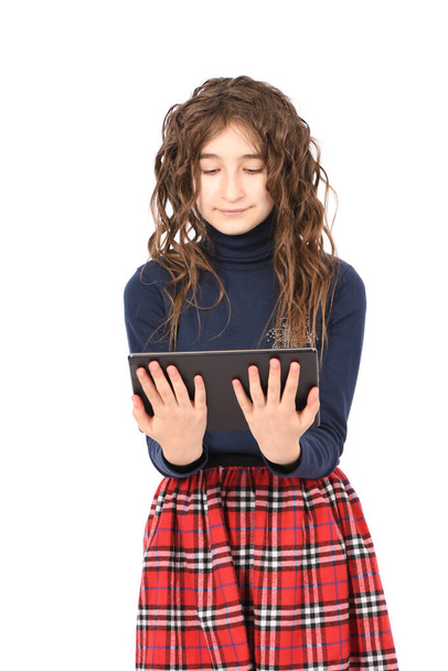 Portrait of pretty curly young girl smile and showing tablet pc isolated on white background. High resolution photo. Full depth of field. - Photo, Image