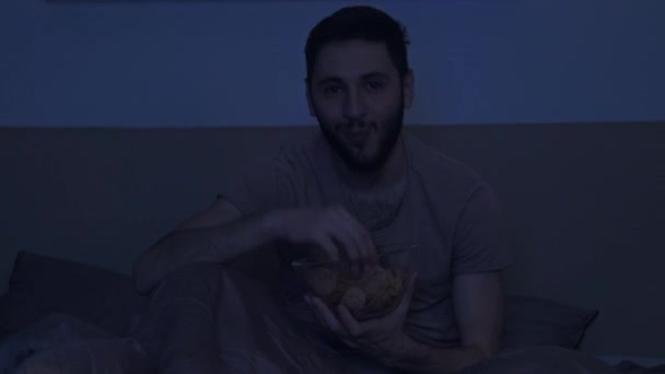 late night movie man watching comedy show bed - Video, Çekim
