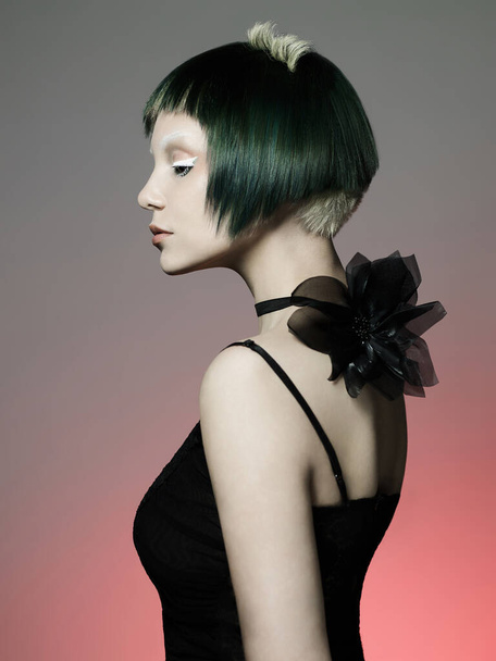 Photo of young lady with bright makeup and modern hairstyle. Beautiul sexy woman in photography studio. - 写真・画像