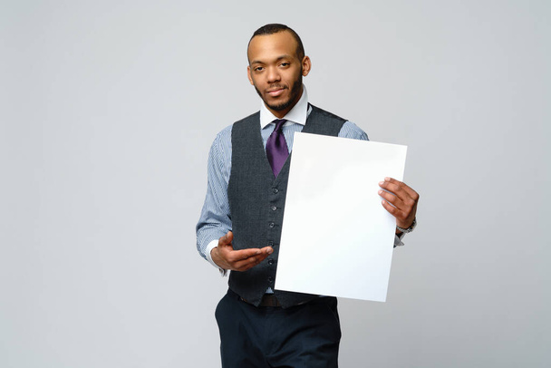 professional african-american business man - presenting holding blank sign - Zdjęcie, obraz