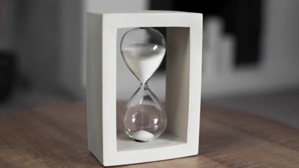 hourglass with white sand is measuring time - Footage, Video