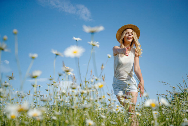 Beautiful woman in nature with flowers.  - Photo, Image