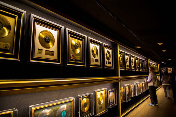 Graceland is a mansion  in Memphis, Tennessee and was home to Elvis Presley. It is located less than four miles north of the Mississippi border. It opened to the public in 1982. His many gold discs and awards are on display in the house - Photo, Image