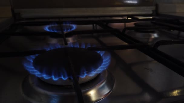 The comforts on the gas stove are lit up and extinguished - Footage, Video