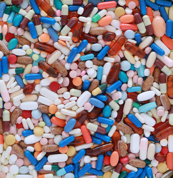Un montón de diferentes medicamentos y píldoras sobre toda la imagen
 - Foto, imagen