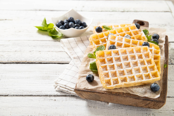 Plate with delicious traditional belgian waffles with fresh blueberries - Photo, Image