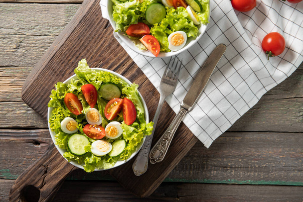 Tasty salad of fresh vegetables with quail eggs. Diet concept - Photo, Image