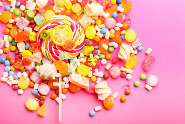 Assortment of sweet candies on color background - Photo, Image